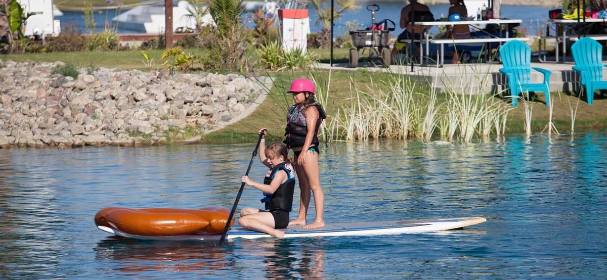 Paddleboarder on the lake at Velocity Island Park